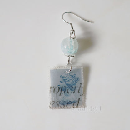 Boucle d’oreille unique en timbre vintage