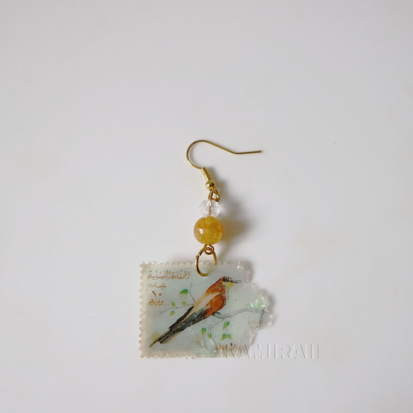 Boucle d’oreille unique en timbre vintage