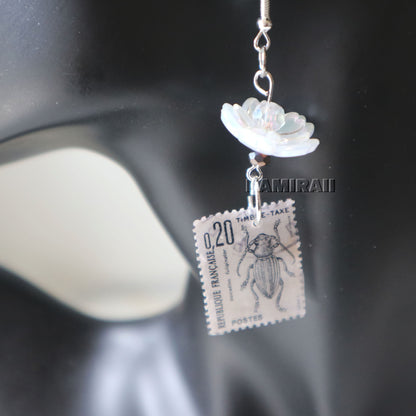 Boucle d’oreille unique en timbre vintage