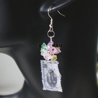 Boucle d’oreille unique en timbre vintage